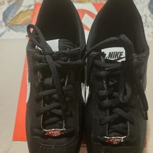 Nike Black Leather Sneakers with White Swoosh